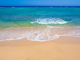 Beautiful wild beach with turquoise water, orange sand and coral reef. Egypt, Marsa alam. Red sea