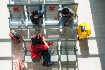 Fototapeta premium Friends at airport terminal seat. Wait to departure