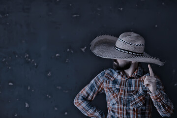 stern cowboy in a hat with brim, straw, retro vintage style, angry man wild west western
