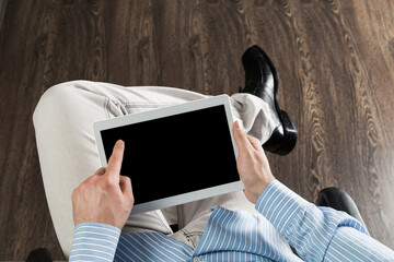 businessman with a tablet, works in the office