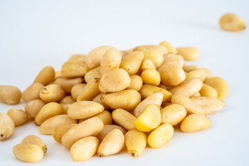 Isolated Pine nuts on a White background Selected Focus