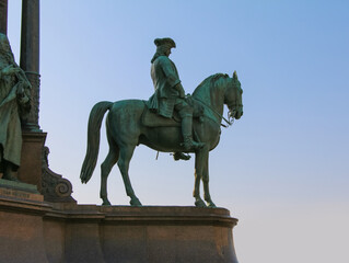 Equestrian figure at the base of the statue of Maria Theresa