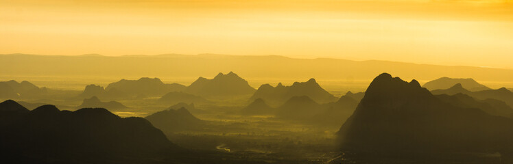 A panoramic beuatiful view of mountain ridges with morning sky and clouds at Phu Kra Dung National park of Thailand