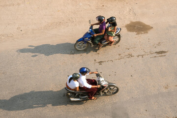 Aerial view of Asian people driving motorbikes, Bagan,...