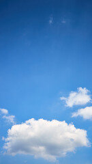 Cloud single lonely in high empty sky with beams vertical composition 16x9 with copyspace.