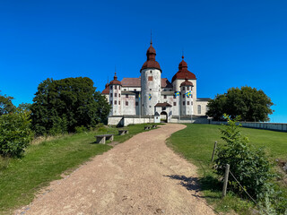 Läckö castle in Sweden with a clear blue sky staying in front of the castle - Architecture Photography	