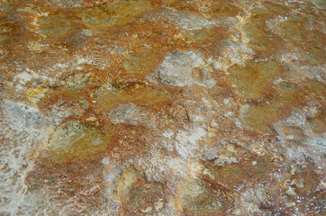 Pamukkale travertine texture. Wavy limestone textured deposits on terraces of carbonate minerals in Pamukkale, Turkey.