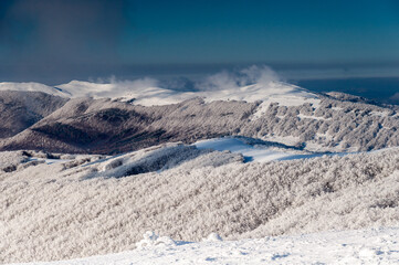Obraz premium A view from the top of Wielka Rawka to the peaks of the Bieszczady Mountains, the Bieszczady Mountains