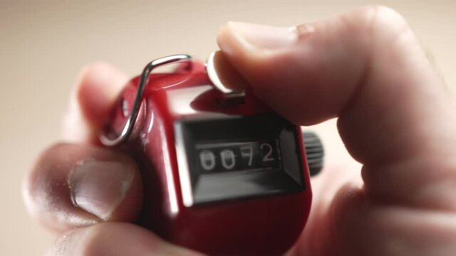 Closeup Manual Counter With Numbers Flipping