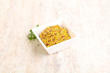Grain mustard sauce in the bowl