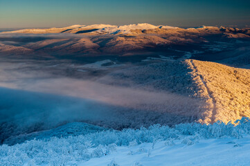 A view from the top of Wielka Rawka to the Bieszczady peaks at sunset, the Bieszczady Mountains