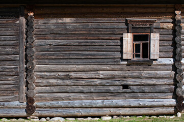 The wall of an old village house with a window