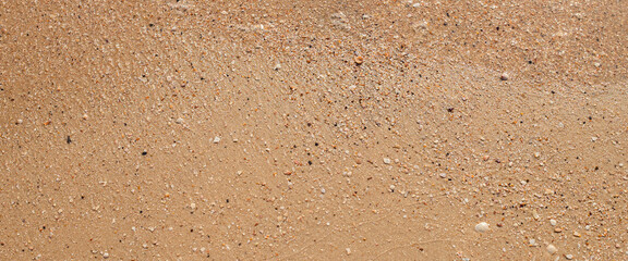 Summer day beach sand texture. Top view, flat lay. Banner