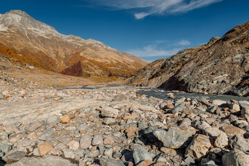 Rocky mountains and river with stones and rocks. Alpine landscape