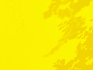 Seamless texture of yellow cement wall a rough surface and leaf shadow, with space for text, for a background...