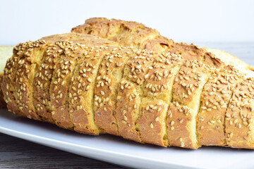 Close up, slice. Chia bread, rich in omega three, healthy, beneficial for our body and characteristic of its yellow color and spongy texture.