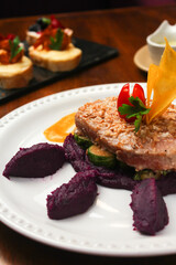 Exotic dish of Salmon with vegetables close up