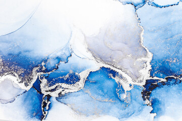 Blue silver abstract background of marble liquid ink art painting on paper . Image of original artwork watercolor alcohol ink paint on high quality paper texture .