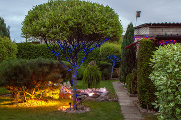 Garden illuminated by lamps - 457743351