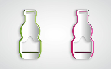 Paper cut Sauce bottle icon isolated on grey background. Ketchup, mustard and mayonnaise bottles with sauce for fast food. Paper art style. Vector