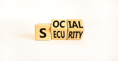 Social security symbol. Turned wooden cubes and changed the word 'social' to 'security' or vice versa. Beautiful white background, copy space. Business, social security concept.