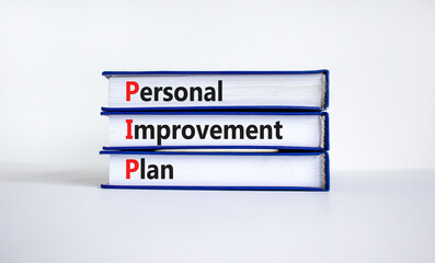 PIP, Personal improvement plan symbol. Words PIP, Personal improvement plan symbol on books on a beautiful white background. Business, PIP, Personal improvement plan symbol concept. Copy space.