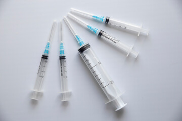 Syringes on white table. Medical concept, subcutaneous injection vaccination, dose. Disease treatment immunization