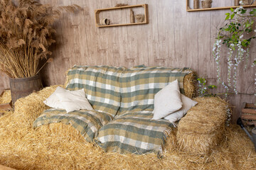 hay bale sofa. photo zone in a rustic style. straw