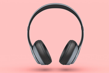 Silver gaming headphones and concept of music equipment isolated on pink.