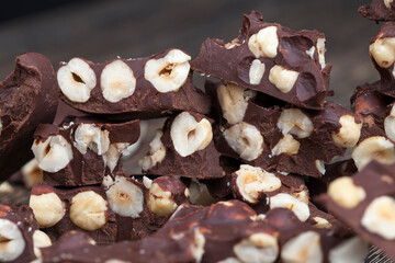 milk chocolate with whole and chunks of hazelnuts