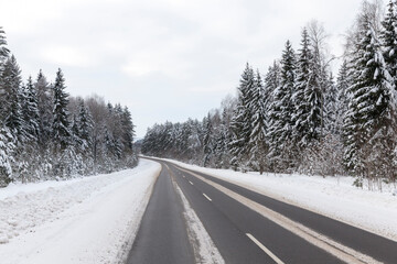 Fototapeta na wymiar winter paved road for vehicles