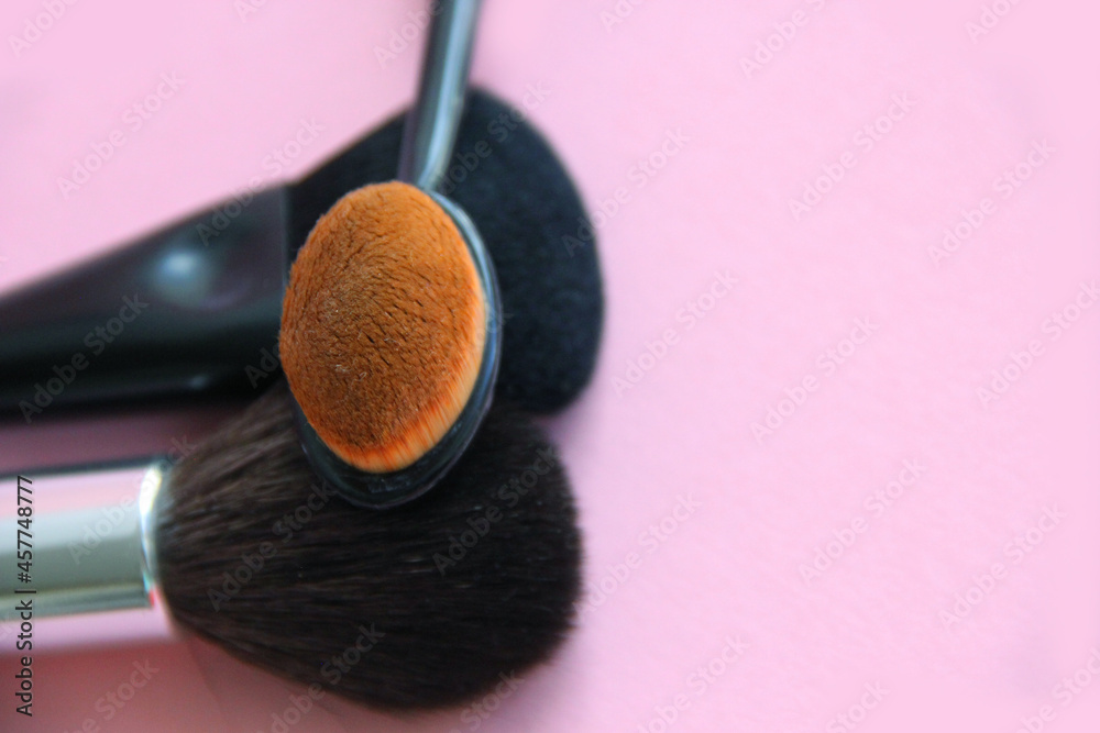 Wall mural makeup brushes on a light background