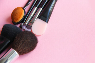 makeup brushes on a light background