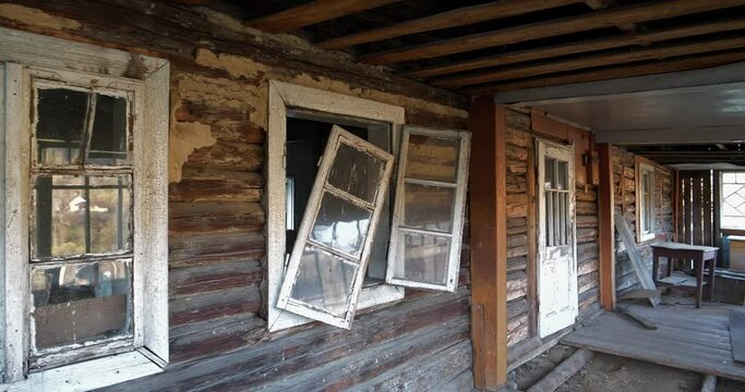 Old wooden abandoned house with broken windows. Cinema 4K 60fps video