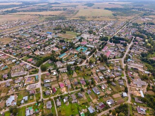 Residential buildings between roads and lawns in suburb