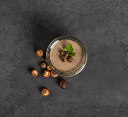 Vegan mushroom dish, Yellow boletus pudding in glass on a dark gray background top view