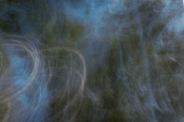 Smoky with sparks highlights dark abstract background.