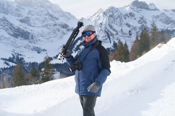 elderly man with camera, mountain hiker admiring mountain winter landscape, Sports Concept, Healthy...