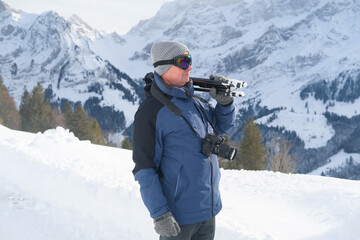 elderly man with camera, mountain hiker admiring mountain winter landscape, Sports Concept, Healthy...