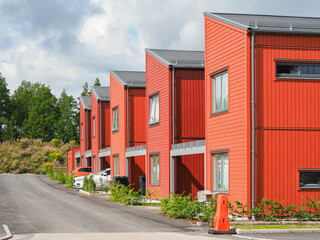 Street with Scandinavian style townhouses or condominium apartments 