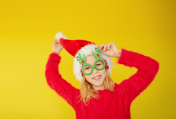 little girl in a santa costume for the new year