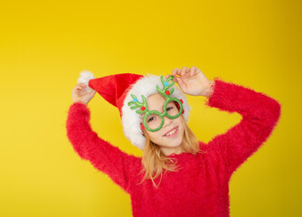 little girl in a santa costume for the new year