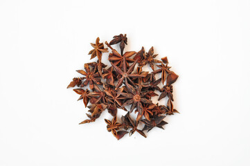 Aromatic anise stars and cinnamon on white background 