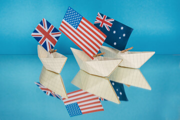 ships with flags of Australia, United States and United Kingdom as new  military alliance security...
