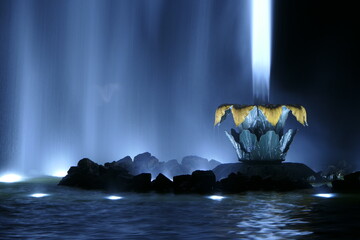 Illuminated water fountain at night in the Herrenhausen Gardens in Hanover Germany. In the...