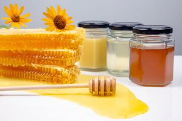 Fresh flower honey in a wooden bowl, spoon and honeycomb. vitamin food for health and life