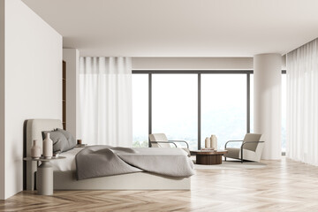 Bright bedroom interior with panoramic window, two armchairs and bed