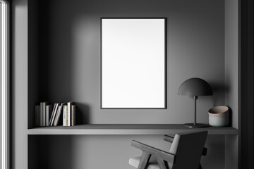 Niche desk with empty framed canvas on dark grey bedroom wall