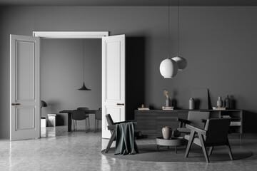 Dark living room interior with three armchairs, chairs, table