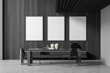 Dark grey living room with three empty canvases over table